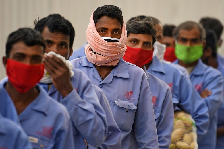 Labourers wearing facemasks
